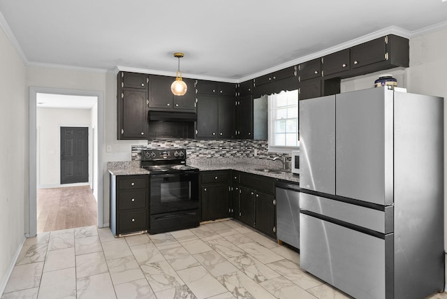 1872 River Rd, Clarksville, TN 37040 - kitchen with appliances with stainless steel finishes, under cabinet range hood, dark cabinetry, light marble finish floors, and ornamental molding
