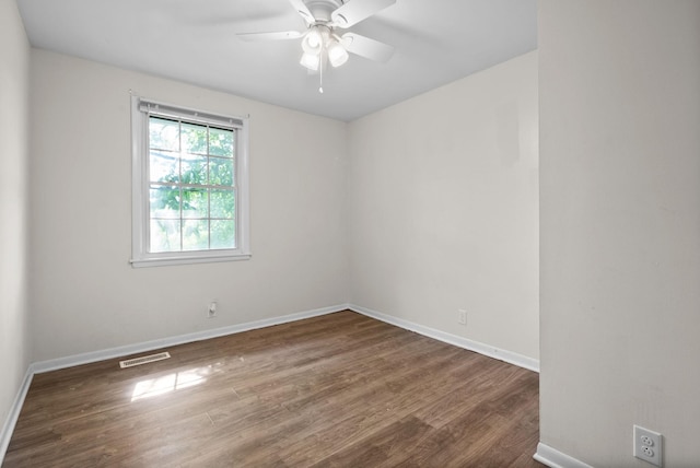 1872 River Rd, Clarksville, TN 37040 - spare room with wood finished floors, a ceiling fan, and baseboards