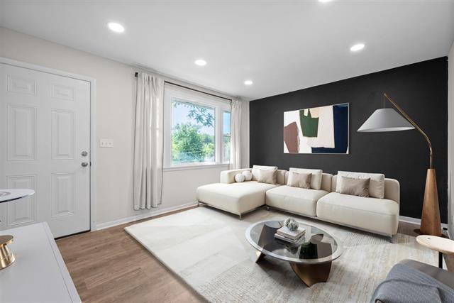 1872 River Rd, Clarksville, TN 37040 - living room with wood finished floors, recessed lighting, and baseboards