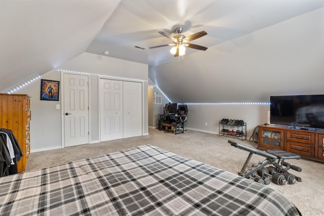 bedroom with carpet flooring, visible vents, lofted ceiling, and ceiling fan