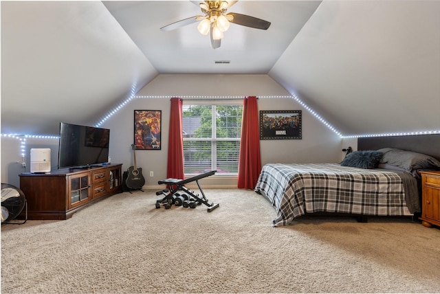 bedroom featuring ceiling fan, visible vents, carpet, and vaulted ceiling