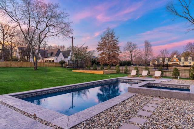 view of pool with a lawn, a patio, a fenced in pool, and fence