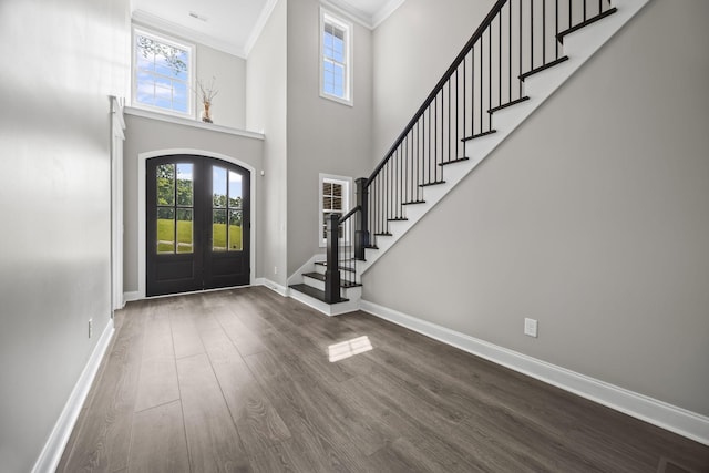601 Joyce Ave, Lewisburg, TN 37091 - entryway featuring french doors, baseboards, dark wood-style flooring, ornamental molding, and stairs