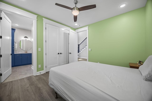 601 Joyce Ave, Lewisburg, TN 37091 - bedroom with connected bathroom, baseboards, dark wood-style floors, and recessed lighting