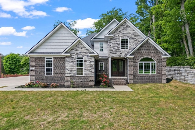601 Joyce Ave, Lewisburg, TN 37091 - craftsman house with a front lawn, french doors, and brick siding