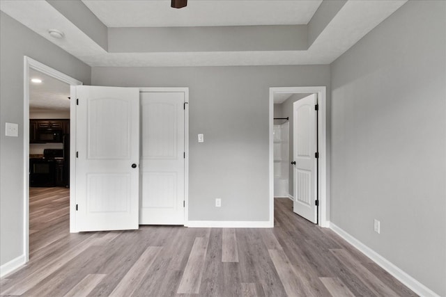 125 Southview Dr, Lewisburg, TN 37091 - unfurnished bedroom with a closet, wood finished floors, and baseboards