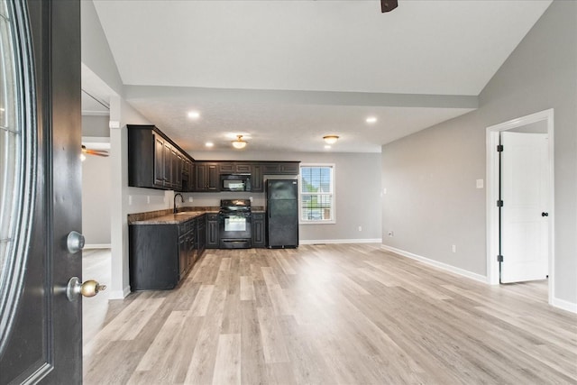 125 Southview Dr, Lewisburg, TN 37091 - kitchen featuring dark brown cabinetry, baseboards, black appliances, light wood-style floors, and lofted ceiling