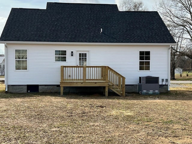 back of property featuring cooling unit, a wooden deck, a shingled roof, and crawl space