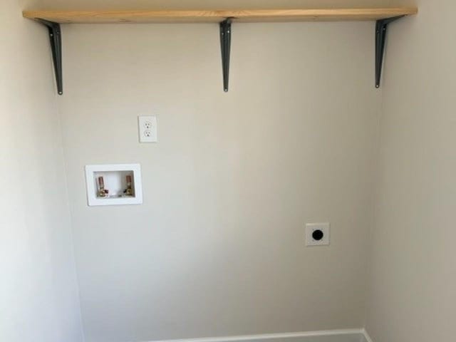 laundry area with laundry area, baseboards, washer hookup, and electric dryer hookup