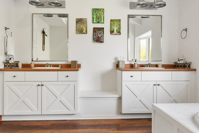 448 Dean Acre Ln, Liberty, TN 37095 - bathroom featuring wood finished floors, two vanities, and a sink