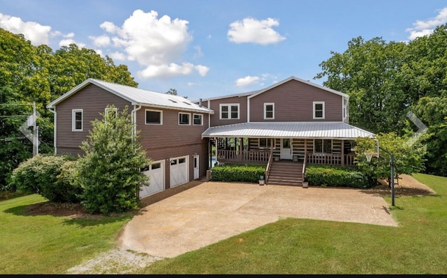 448 Dean Acre Ln, Liberty, TN 37095 - view of front of property with an attached garage, concrete driveway, a porch, and a front lawn