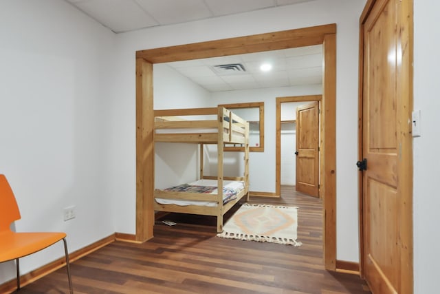 448 Dean Acre Ln, Liberty, TN 37095 - unfurnished bedroom with a paneled ceiling, baseboards, visible vents, and wood finished floors