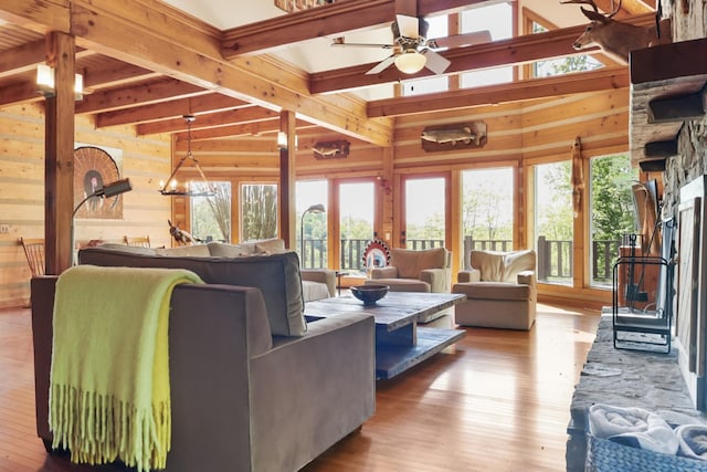 448 Dean Acre Ln, Liberty, TN 37095 - living area featuring wooden walls, wood finished floors, ceiling fan, and vaulted ceiling with beams