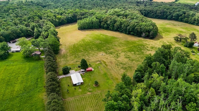 birds eye view of property featuring a rural view and a forest view