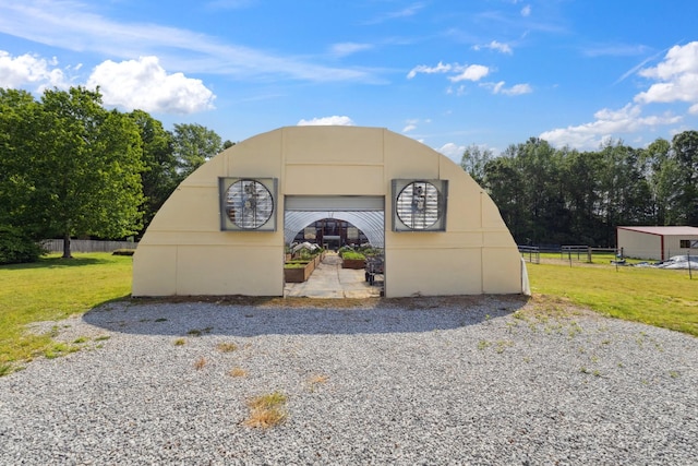 view of outdoor structure featuring fence