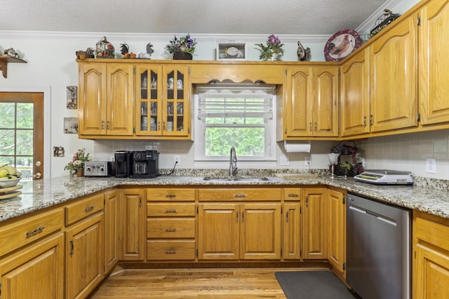 746 Shadow Ln, Belvidere, TN 37306 - kitchen featuring dishwasher, a sink, healthy amount of natural light, a textured ceiling, and light stone countertops