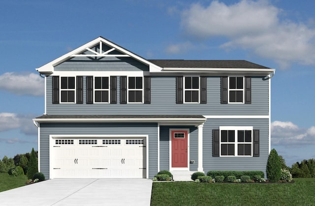 view of front of home featuring driveway, a garage, and a front yard