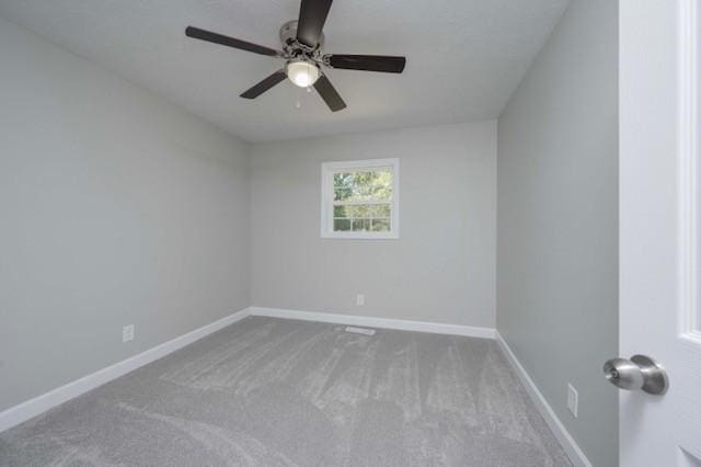unfurnished room featuring ceiling fan, carpet, and baseboards