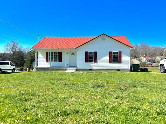 bungalow-style house with metal roof, a porch, a front yard, and crawl space