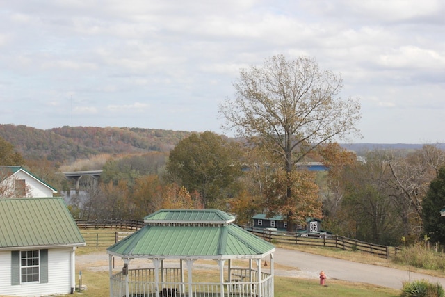 exterior space featuring fence and a gazebo