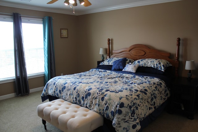 bedroom with light colored carpet, crown molding, baseboards, and multiple windows