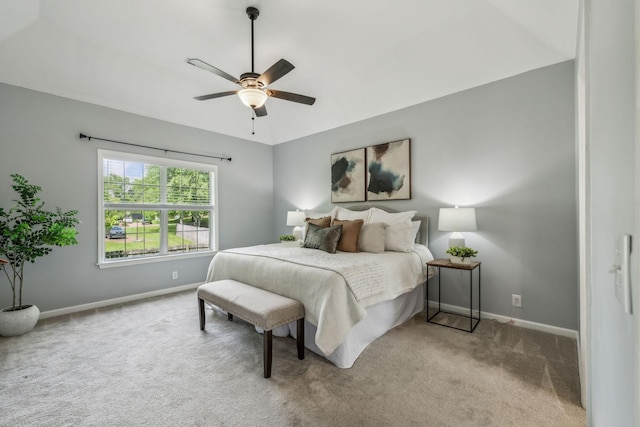 bedroom featuring baseboards, ceiling fan, and carpet floors