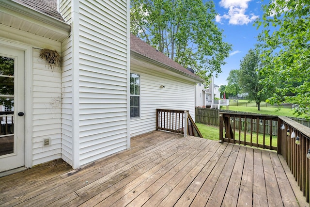 wooden deck featuring fence