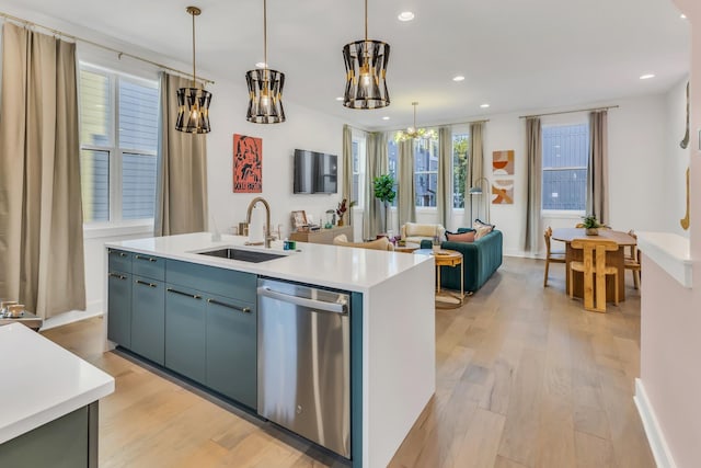 2176 Carson St Unit 5, Nashville, TN 37211 - kitchen with a sink, light wood-style flooring, light countertops, stainless steel dishwasher, and a notable chandelier
