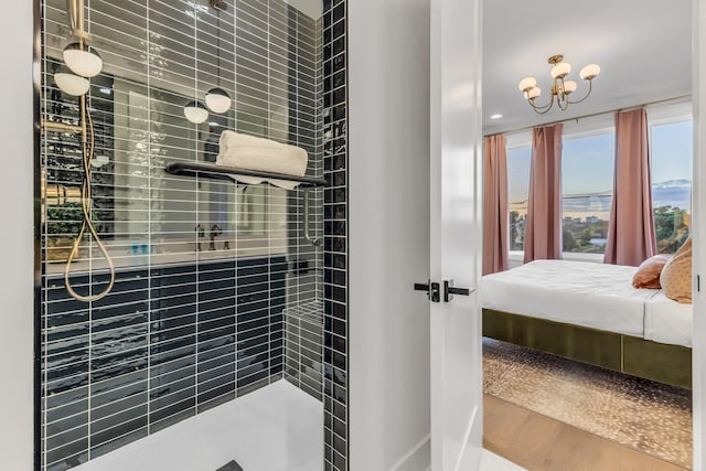 2176 Carson St Unit 5, Nashville, TN 37211 - ensuite bathroom with ensuite bath, tiled shower, and a notable chandelier