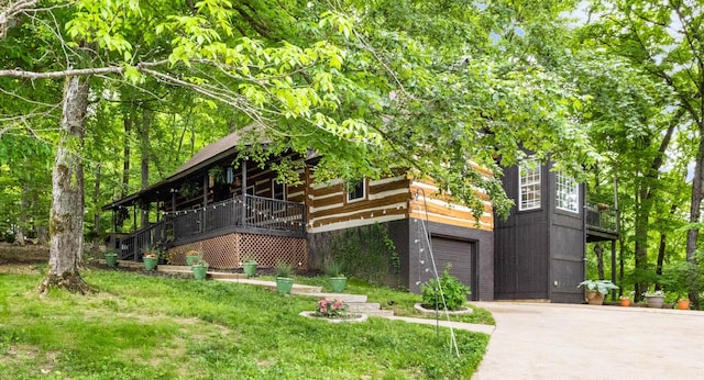 460 Seven Springs Rd, Clarksville, TN 37043 - log-style house with concrete driveway, an attached garage, stairs, and a front yard