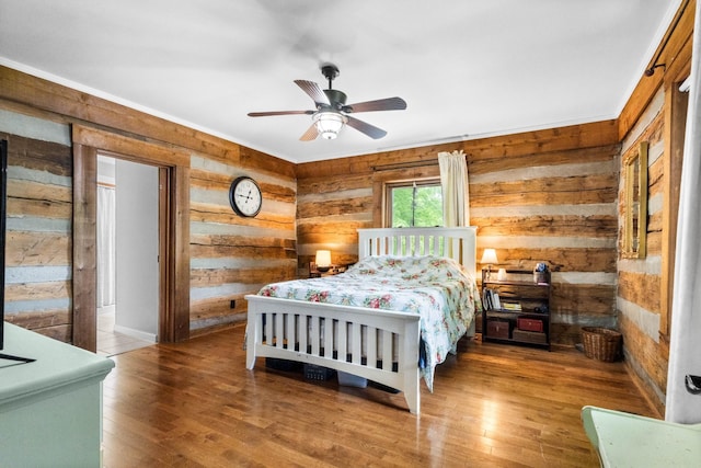 460 Seven Springs Rd, Clarksville, TN 37043 - bedroom with ceiling fan, crown molding, wooden walls, and hardwood / wood-style floors