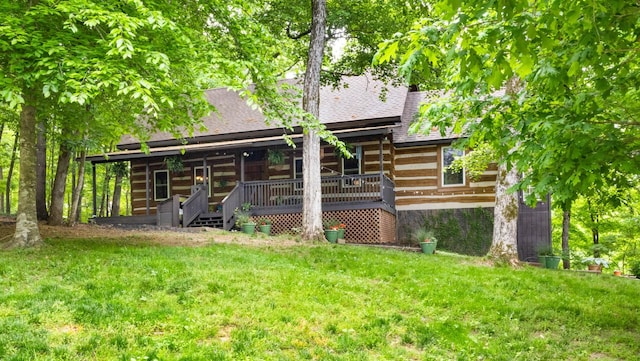 460 Seven Springs Rd, Clarksville, TN 37043 - back of house featuring a shingled roof, covered porch, and a yard