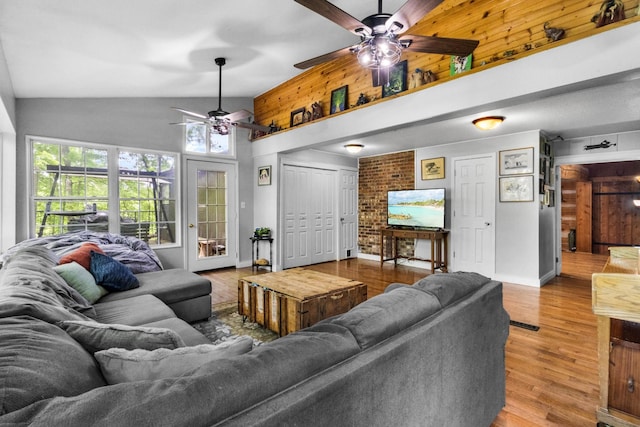 460 Seven Springs Rd, Clarksville, TN 37043 - living area with wooden walls, wood finished floors, a ceiling fan, and high vaulted ceiling