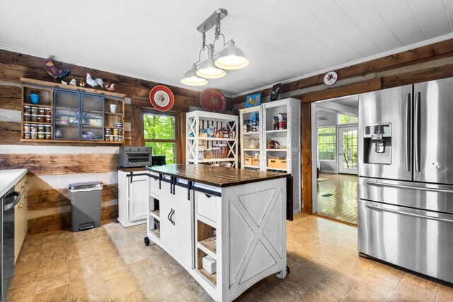 460 Seven Springs Rd, Clarksville, TN 37043 - kitchen with wooden counters, open shelves, stainless steel fridge with ice dispenser, white cabinetry, and wooden walls
