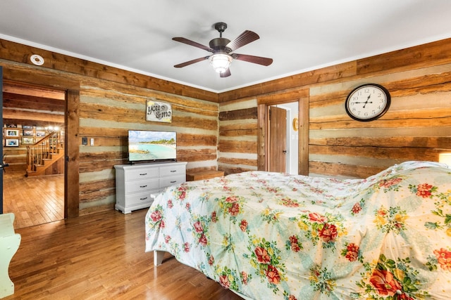 460 Seven Springs Rd, Clarksville, TN 37043 - bedroom featuring ornamental molding, wooden walls, and wood finished floors