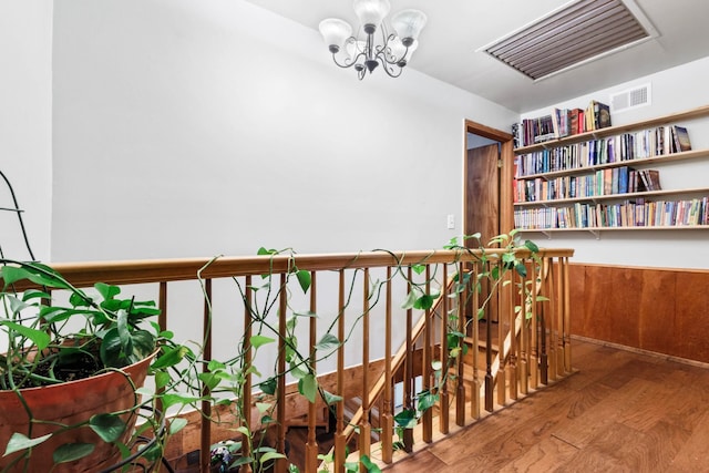460 Seven Springs Rd, Clarksville, TN 37043 - interior space featuring wood finished floors, an upstairs landing, visible vents, an inviting chandelier, and wainscoting