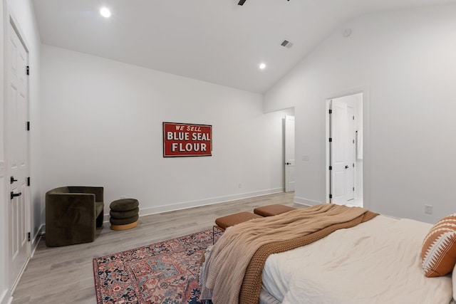bedroom with lofted ceiling, light wood-style flooring, recessed lighting, baseboards, and visible vents
