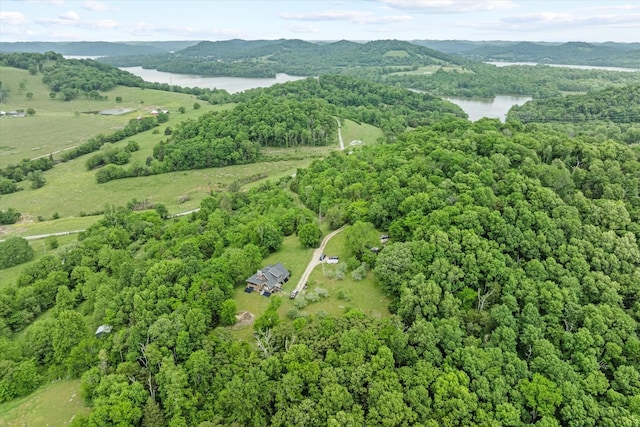 bird's eye view featuring a water and mountain view and a forest view