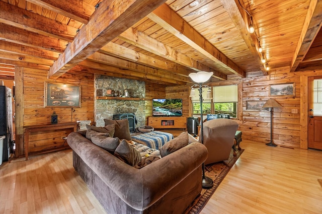 living room featuring wood walls, beam ceiling, wooden ceiling, and hardwood / wood-style flooring