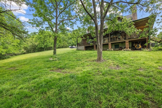 view of yard with a deck