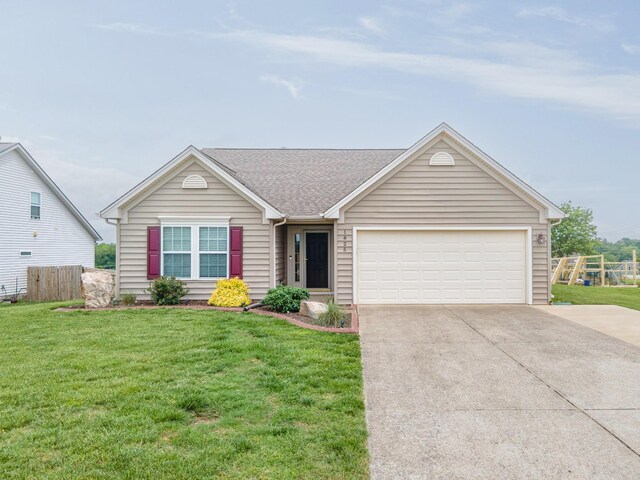 single story home with a front yard, an attached garage, fence, and driveway