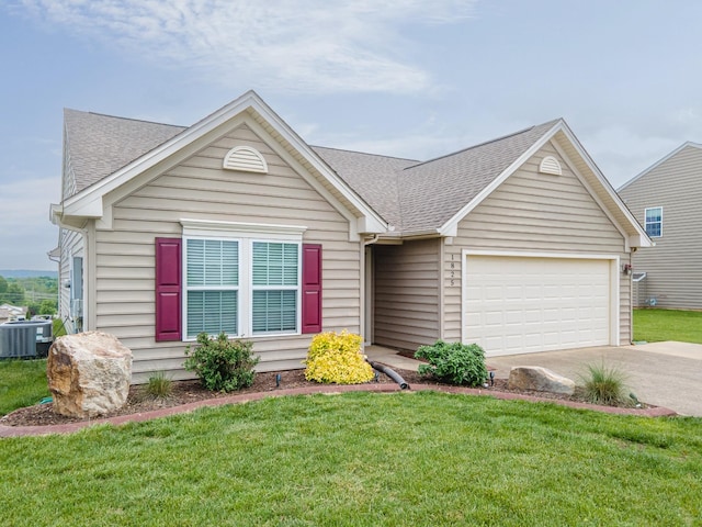 single story home featuring an attached garage, cooling unit, a shingled roof, a front yard, and driveway
