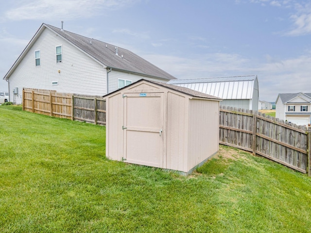 view of shed with a fenced backyard