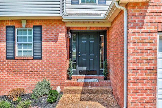 entrance to property with brick siding