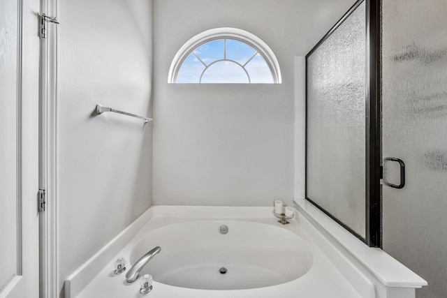 full bathroom with a bath
