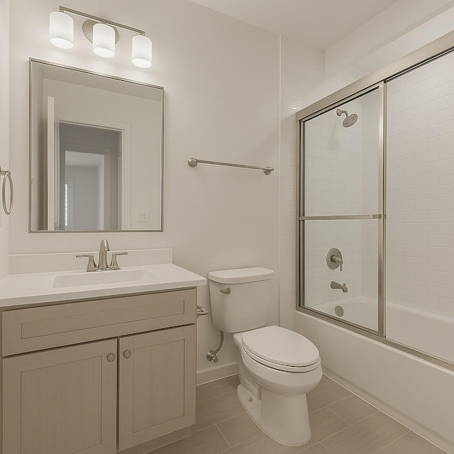 full bath featuring toilet, baseboards, tile patterned flooring, bath / shower combo with glass door, and vanity