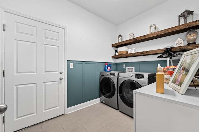 567 Oakvale Ln, Mount Juliet, TN 37122 - clothes washing area with independent washer and dryer, a wainscoted wall, and a decorative wall