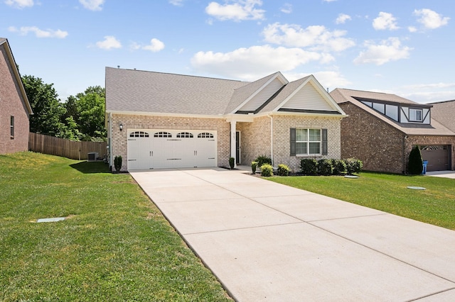567 Oakvale Ln, Mount Juliet, TN 37122 - view of front facade featuring a garage, concrete driveway, brick siding, and roof with shingles