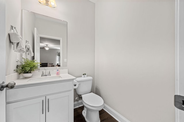 567 Oakvale Ln, Mount Juliet, TN 37122 - half bath featuring wood finished floors, toilet, vanity, and baseboards
