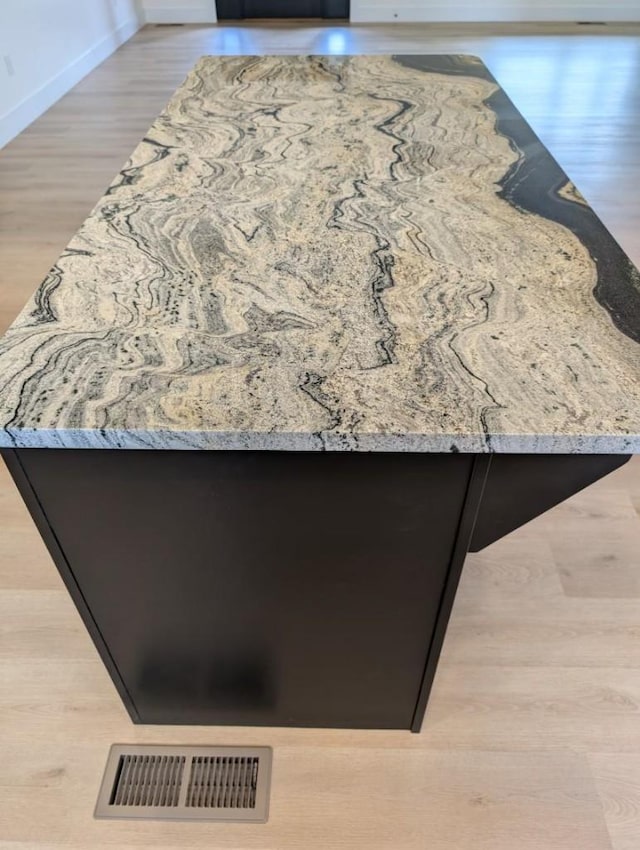 details with visible vents and wood finished floors